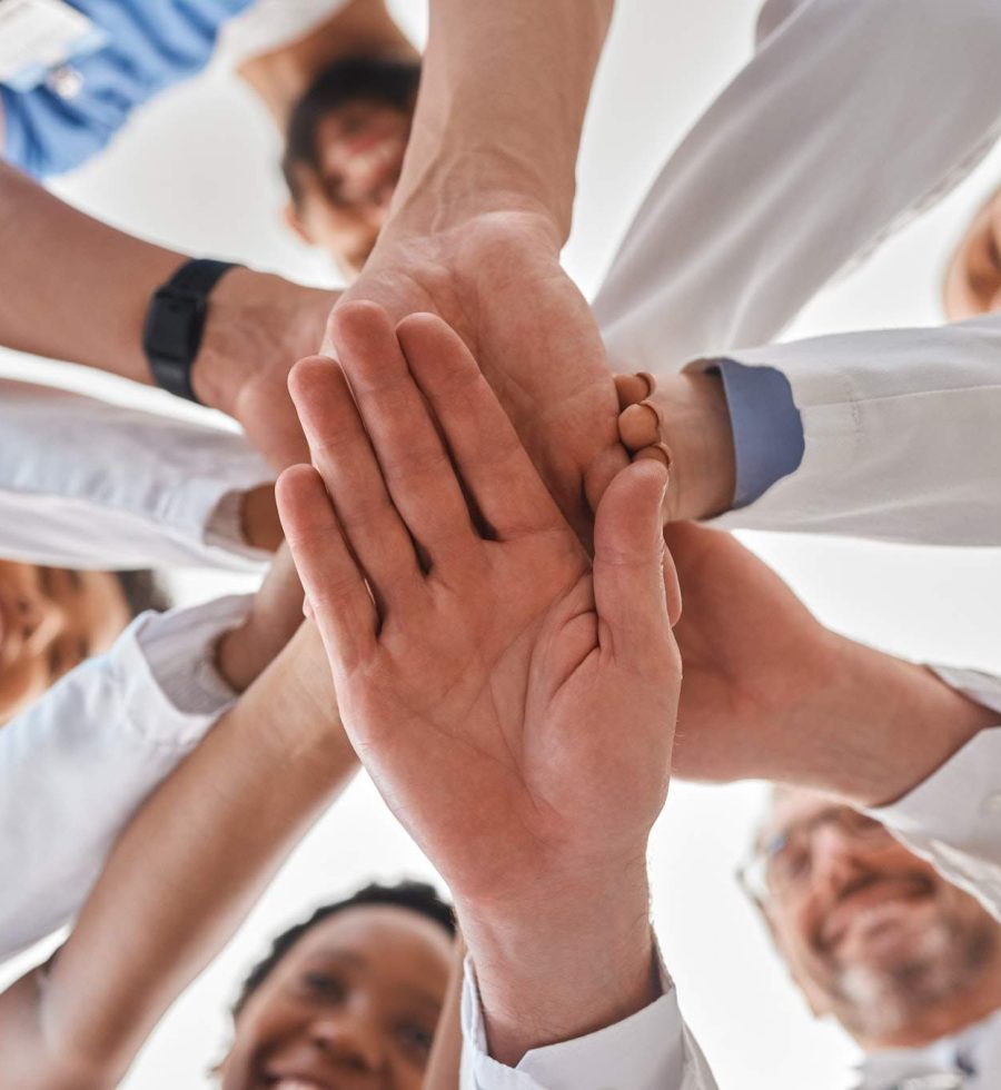 Hands, doctor and teamwork in hospital for motivation, inspiration and diversity in at work. Medica